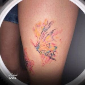 watercolour butterfly tattoo thigh 